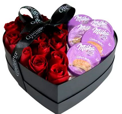 Basket of chocolates for girlfriend with roses and Milka