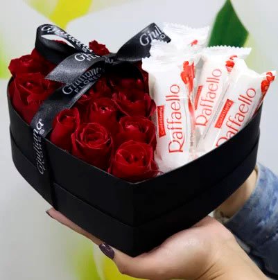 Basket of chocolates for girlfriend with Raffaello and roses
